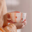 Tasse en céramique Rayures d’oranges de Moi d’abord rayée pêche et orange