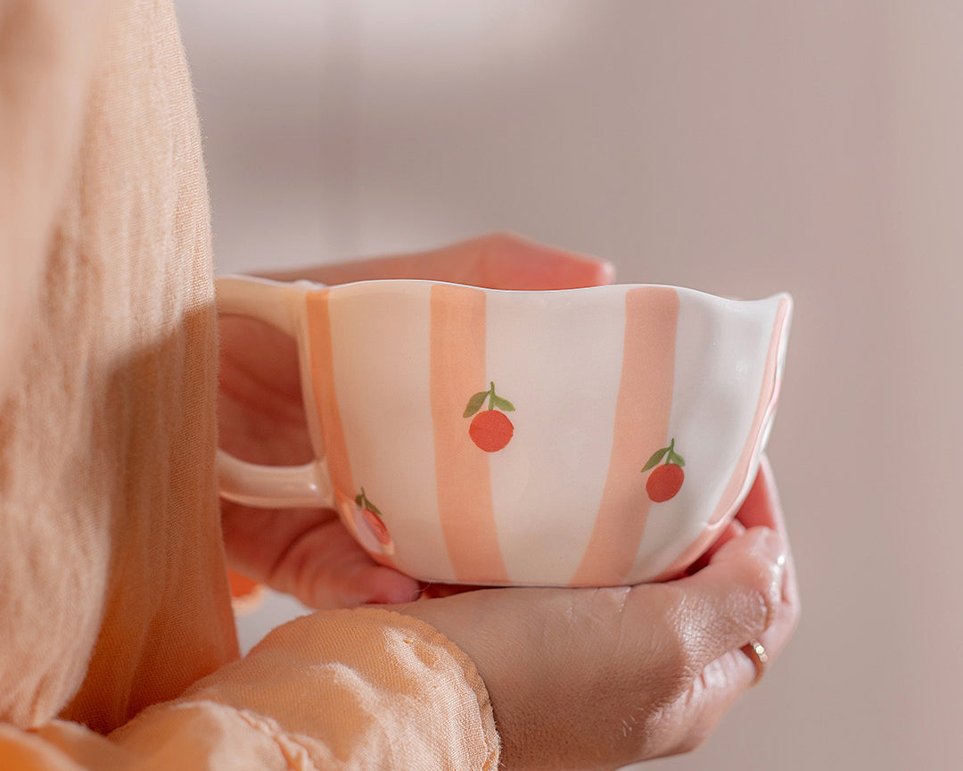 Tasse en céramique Rayures d’oranges de Moi d’abord rayée pêche et orange